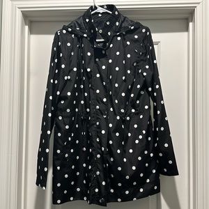 Women’s black and white polka dot rain coat